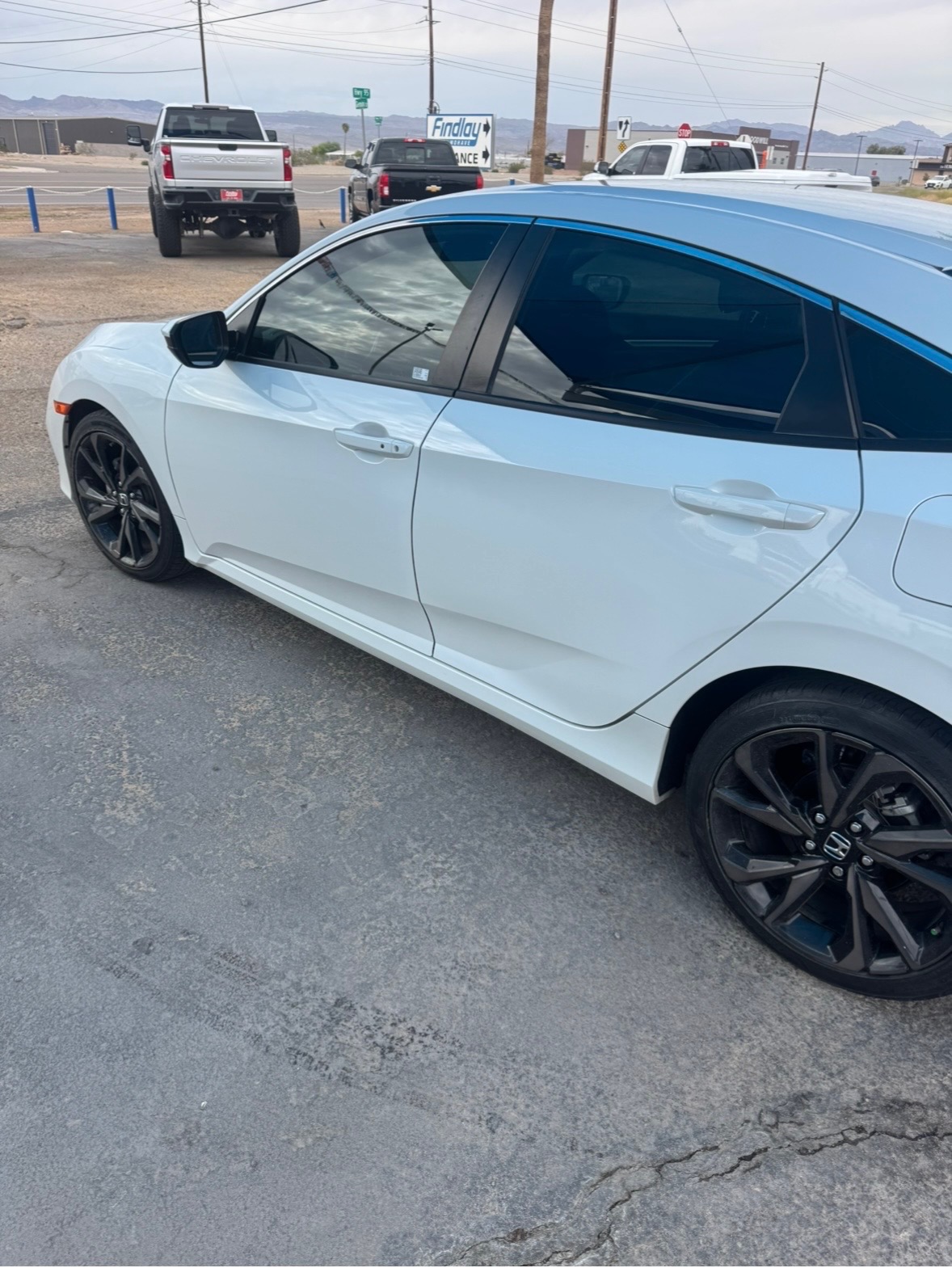 White Honda Civic rear door restored after paintless dent repair